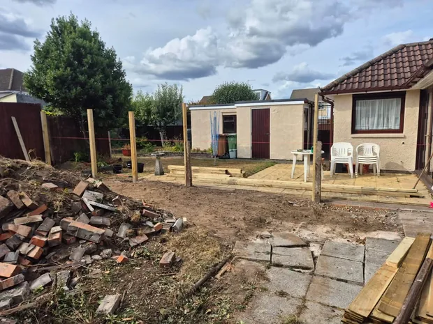 Groundworks under way for a new garden layout and outbuilding at a Caerphilly property